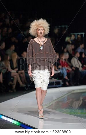 ZAGREB, CROATIA - MARCH 28, 2014: Fashion model wearing clothes designed by Marina Design and Marija Ivanovic jewelry on the 'Fashion.hr' fashion show