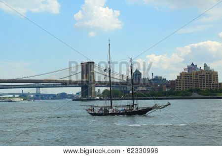 Clipper City Tall Ship next to Brooklyn Bridge