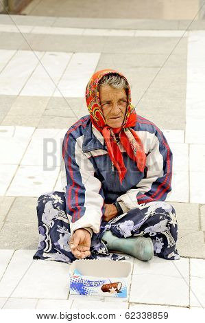 A beggar woman begging on a pedestrian street in Prilep, Macedonia.