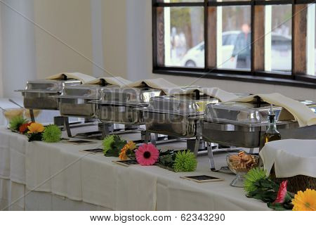 Long table with serving warmers