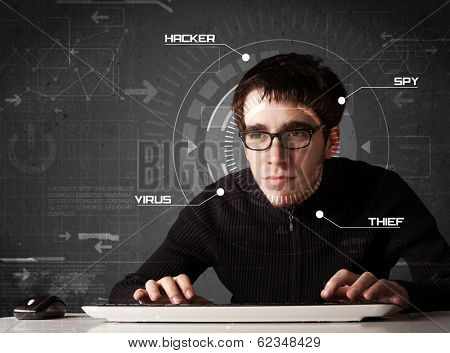 Young hacker in futuristic enviroment hacking personal information on tech background