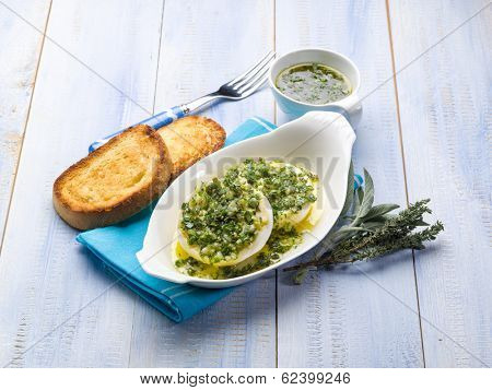 marinated tomino cheese with herbs