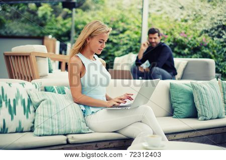 Businesspeople using technology, attractive blonde hair woman typing something on computer keyboard