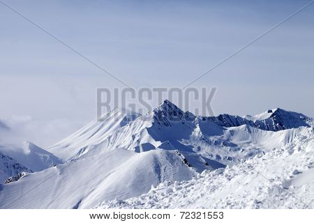 View From Off-piste Slope At Mountains In Fog