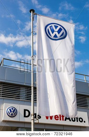 Samara, Russia - September 21, 2014: The Flag Of Volkswagen Over Blue Sky. Volkswagen Is The Biggest