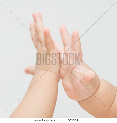 Isolated Baby Hand Touching Together