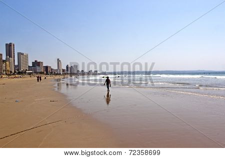 Early Morning Beach Landscape And City Skyline