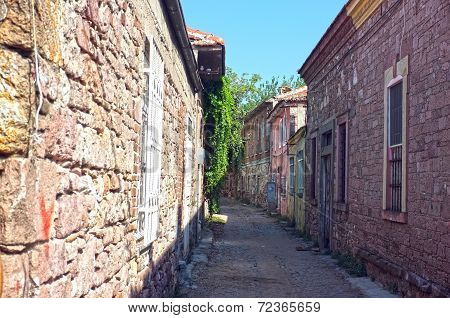 Narrow road between old stone houses