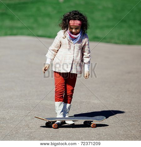 little girl with skateboard