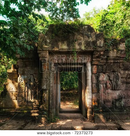 Entrance Gate Ruins Of Baphuon Temple With Growing Trees. Angkor Wat Complex, Siem Reap, Cambodia