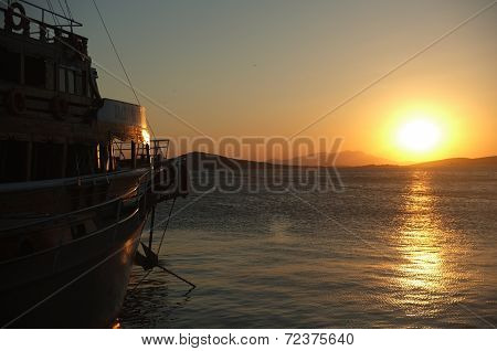 Passenger boat at a marina at dusk