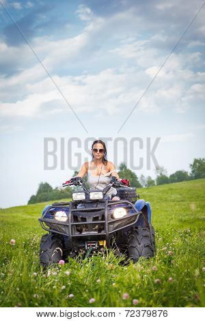 Elegant Woman Riding Extreme Quadrocycle