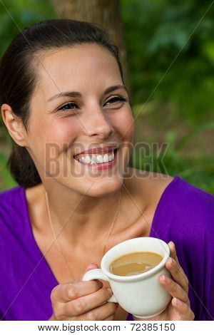 Beautiful Young Woman Drinking Coffee Outdoors