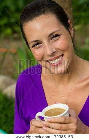 Beautiful Young Woman Drinking Coffee Outdoors