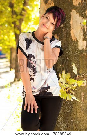 Beautiful woman with makeup in fashion clothes on nature