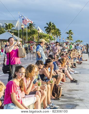 People Enjoy The Sunset Point At Mallory Square In Key Wes