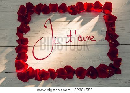 Valentines love hearts against frame of rose petals