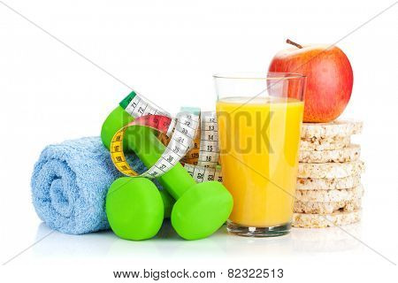 Two green dumbells, tape measure and healthy food. Fitness and health. Isolated on white background