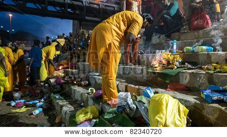 KUALA LUMPUR, MALAYSIA - FEBRUARY 3, 2015: Hindu devotees perform prayers at the Sri Mahamarriamman temple in Batu Caves. Hundreds of thousands of devotees come here for the Thaipusam prayers.