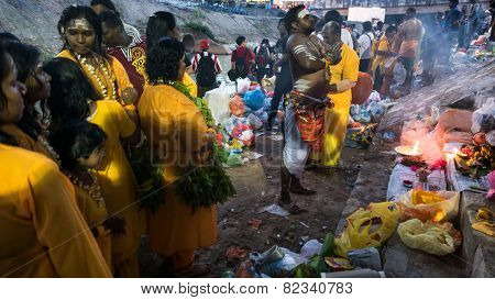 KUALA LUMPUR, MALAYSIA - FEBRUARY 3, 2015: Hindu devotees perform prayers at the Sri Mahamarriamman temple in Batu Caves. Hundreds of thousands of devotees come here for the Thaipusam prayers.