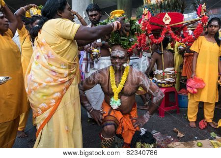 KUALA LUMPUR, MALAYSIA - FEBRUARY 3, 2015: Hindu devotees perform prayers at the Sri Mahamarriamman temple in Batu Caves. Hundreds of thousands of devotees come here for the Thaipusam prayers.