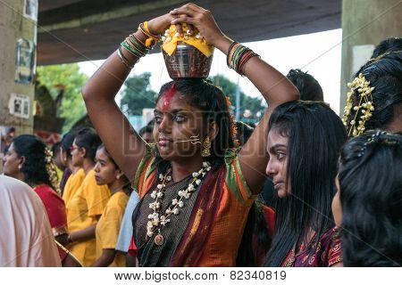 KUALA LUMPUR, MALAYSIA - FEBRUARY 3, 2015: Hindu devotees perform prayers at the Sri Mahamarriamman temple in Batu Caves. Hundreds of thousands of Hindu devotees come here for the Thaipusam prayers.