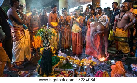 KUALA LUMPUR, MALAYSIA - FEBRUARY 3, 2015: Hindu devotees perform prayers at the Sri Mahamarriamman temple in Batu Caves. Hundreds of thousands of devotees come here for the Thaipusam prayers.