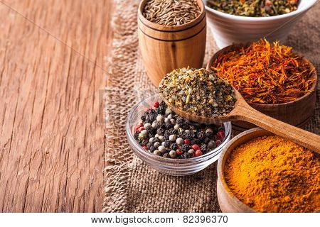 Spices In A Wooden And Glass Bowls