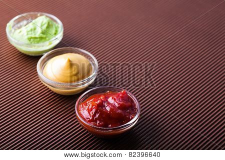 Adjika,mustard,wasabi In A Glass Bowl