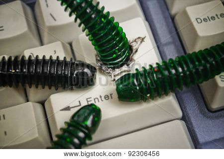 computer worm attacking computer system by penetrating a computer button on a keyboard - worm infection