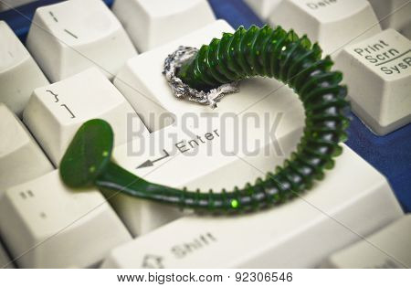 computer worm attacking computer system by penetrating a computer button on a keyboard - worm infection