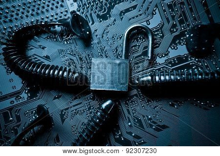 computer security breach due to worm attack - worm on computer circuit board with open security lock