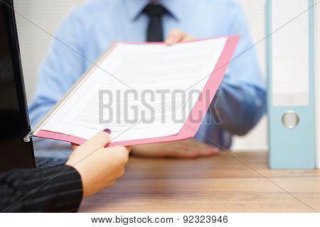 Business Woman Is Passing Document To Manager