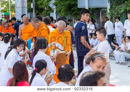 Many people give food and drink for alms to 1536 Buddhist monks in visakha bucha day
