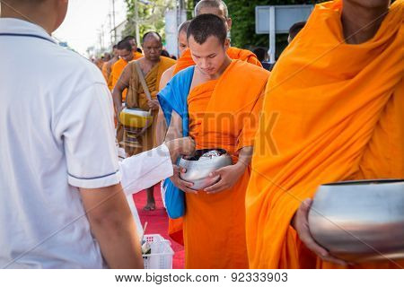 Many people give food and drink for alms to 1536 Buddhist monks in visakha bucha day