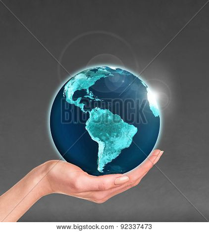 Planet earth in a human hand