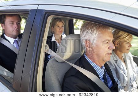 Group Of Business Colleagues Car Pooling Journey Into Work