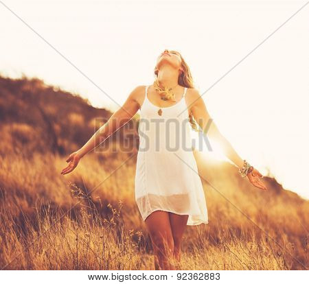 Young Woman Outdoors Fashion Lifestyle Portrait. Soft warm sunny colors. Happy free lifestyle.