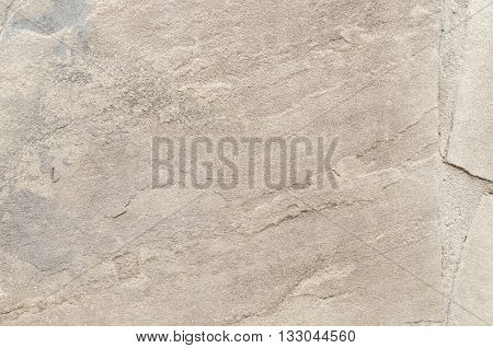 Piece of stone with cracks. Abstract background.