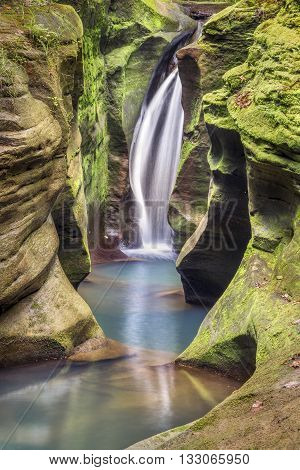 Secluded Robinson Falls also know as Corkscrew Falls flows in the Hocking Hills of Ohio.