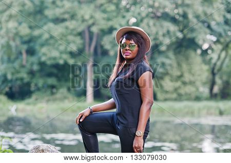 African American Plump Woman At Hat And Sunglasses