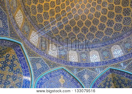 Isfahan, Iran - December 13, 2015: Sheikh Lotfollah Mosque at Naqhsh-e Jahan Square in Isfahan, Iran. Ceiling view