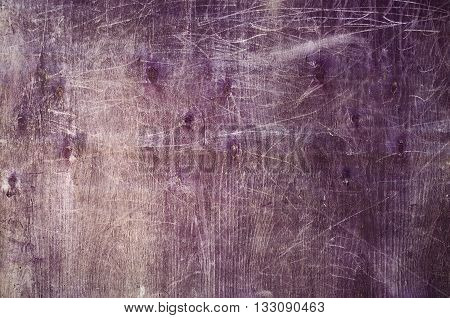 texture of old wooden plywood painted purple with scratches