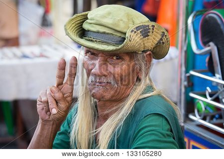 BANGKOK THAILAND - JANUARY 21 2015: An unidentified man living in a poor district of Bangkok Klong Toe. Khlong Toei is one of Bangkok's poorest areas.
