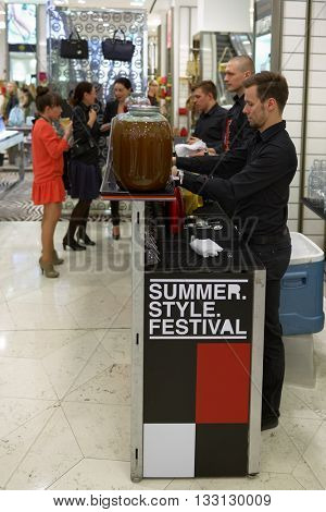 ST. PETERSBURG, RUSSIA - MAY 20, 2016: Barista preparing drinks for guests of the Summer. Style. Festival in the department store DLT. The event promote the healthy lifestyle