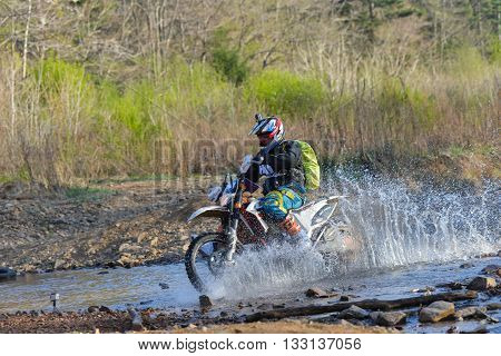 Vladivostok, Russia - may 1, 2014: cars, motorcycles, ktm Enduro and ATV, go off-roading in five-day race Russian rally 2014