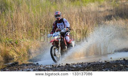 Vladivostok, Russia - may 1, 2014: cars, motorcycles, ktm Enduro and ATV, go off-roading in five-day race Russian rally 2014