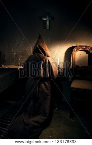 Ancient monk prisoner in dark castle prison