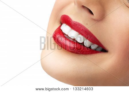 red lipstick and white teeth in photostudio