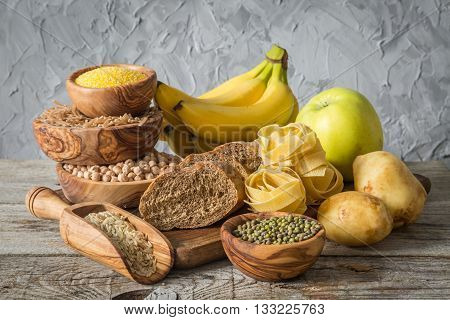 Selection of comptex carbohydrates sources on wood background, copy space